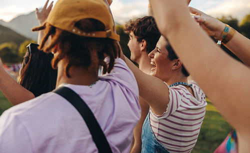 Crowd of excited music lovers celebrating unforgettable moments at a summer concert