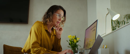 Businesswoman working from home office on laptop
