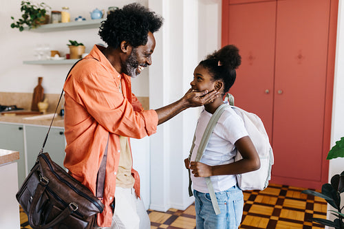 Father and daughter's morning routine: Happy family saying goodbye in the morning