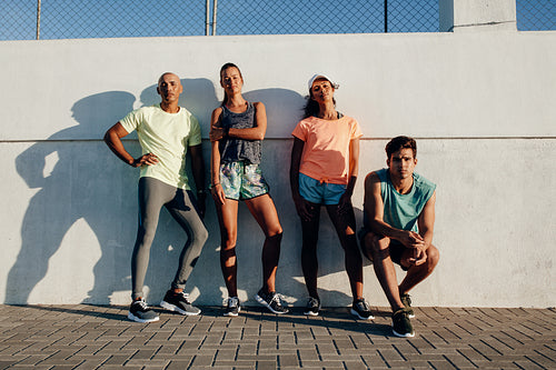Group of runners relaxing after workout
