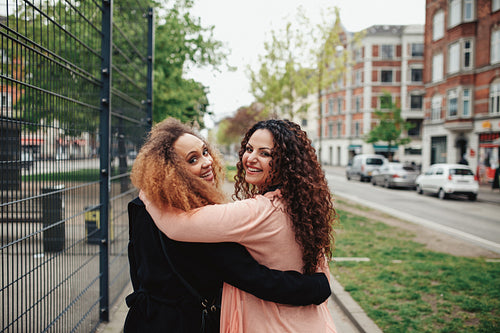 Candid shot of riends on the city street