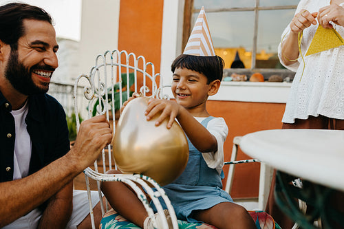 Family celebration with father and son enjoying activities outdoors