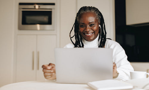Happy businesswoman working from home