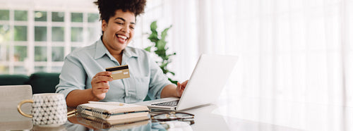 Woman doing online shopping on laptop