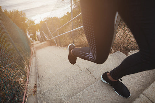 Woman training on the stairs outdoors