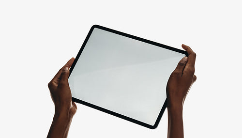 Hands holding a blank tablet with a clean white background