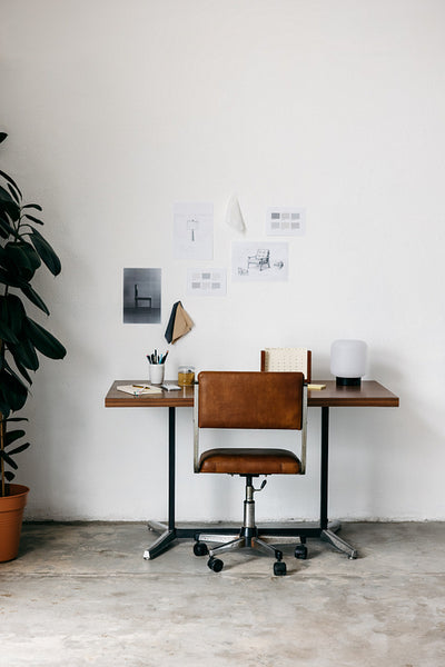 Home office workspace with clean desk and chair in minimalist interior