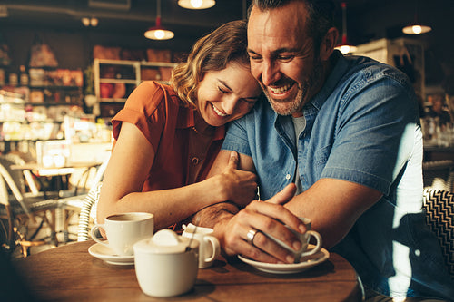 Loving couple at sitting together at a cafe
