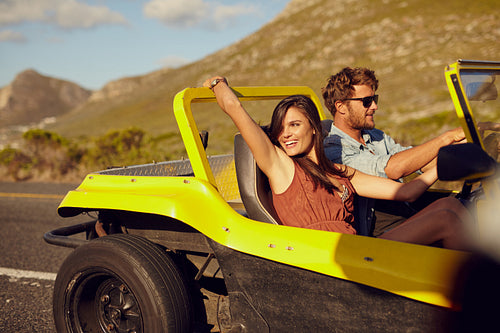 Relaxed couple enjoying in the car ride