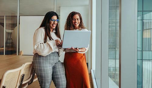 Young professionals collaborating in a modern tech startup office space