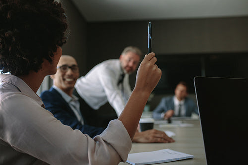 Woman asking a query during a meeting