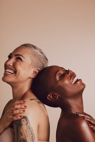 Beautiful women standing together and smiling