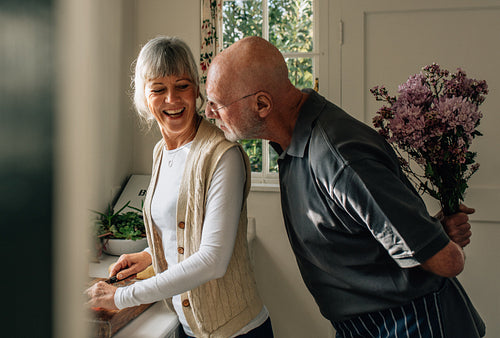 Romantic senior couple at home having fun