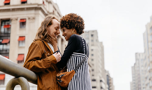 Affectionate embrace on city streets, love and connection urban backdrop
