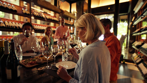 Wine tasting room: Enjoying a private wine tasting experience with friends in an elegant wine cellar setting