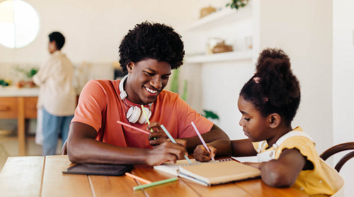 Happy kids learning and creating together at home