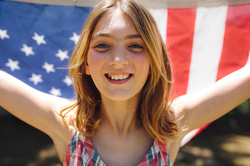 Portrait of a girl holding american flag