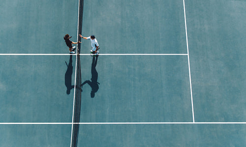 Professional tennis players handshakes after the match