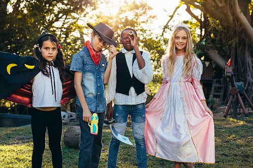 Group of kids having fun in backyard garden 