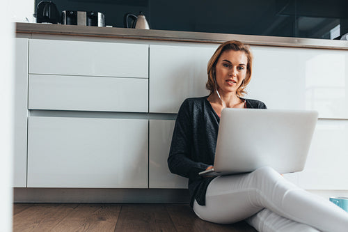 Woman working on laptop computer at home