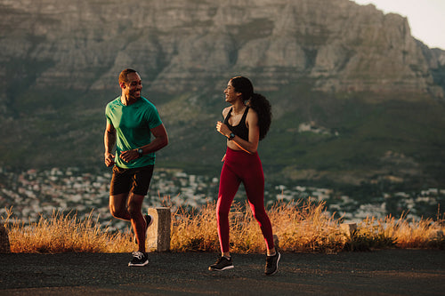 Athletic couple on a long distance run