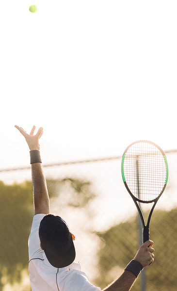 Tennis player serving the ball