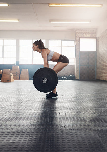 Fitness woman doing weightlifting exercise