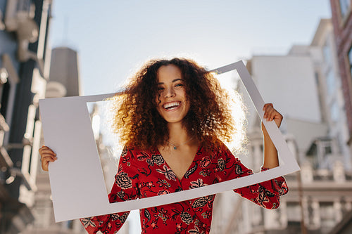 Attractive woman with photo frame