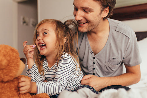 Father and daughter playing at home
