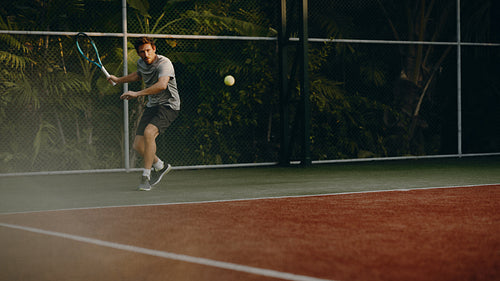 Tennis player ready to return a shot from the baseline