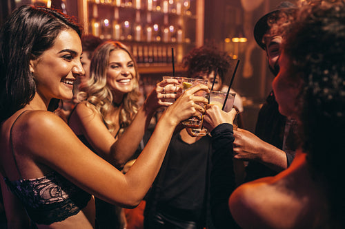 Young people with cocktails at nightclub