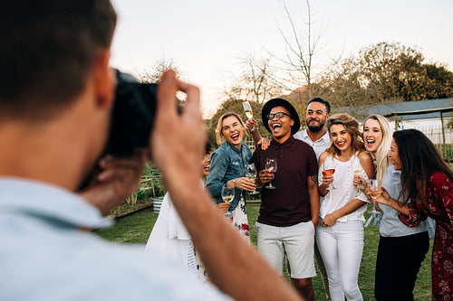 Group of people posing for a photograph at party