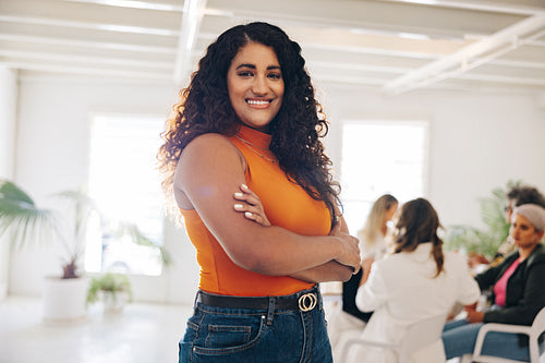 Smiling businesswoman standing in a meeting room
