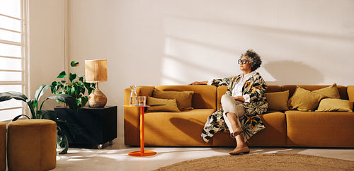 Thoughtful businesswoman sitting in an office lobby