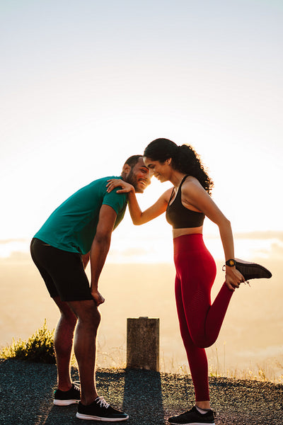 Athletic couple relaxing after a sprint