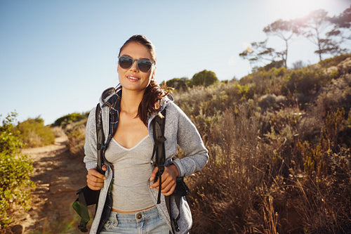 Beautiful hiker woman trekking in nature