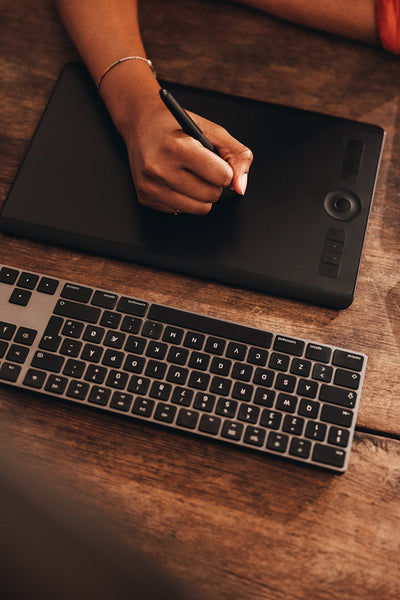 Young graphic designer drawing on a digital tablet