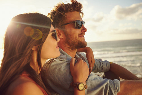 Couple enjoying the beach view.
