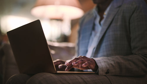 Businesswoman using laptop computer at hotel lobby