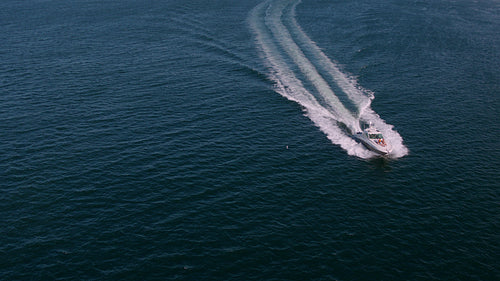 Private yacht sailing in sea with people on deck