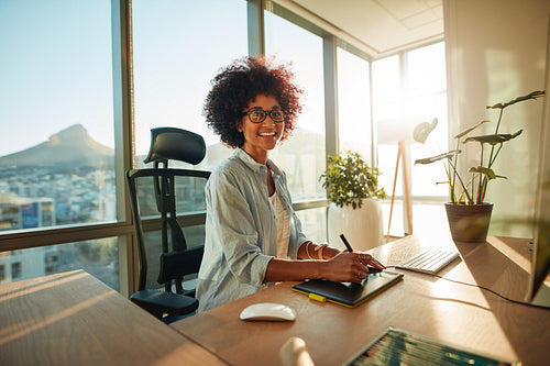 Young woman at her creative workplace