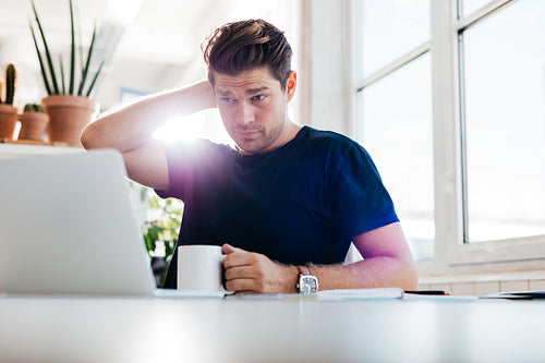 Thoughtful business man at his work place