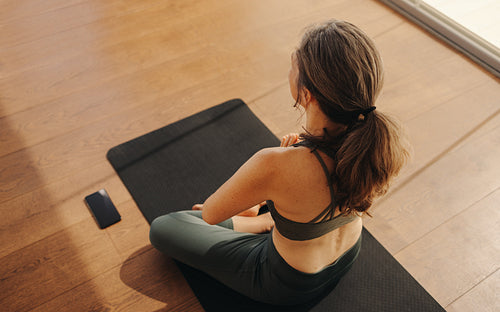 Mature woman meditating in prayer position