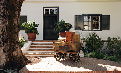 Luggage bags outside the entrance of a hotel