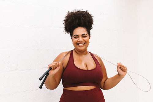 Plus size woman with skipping rope