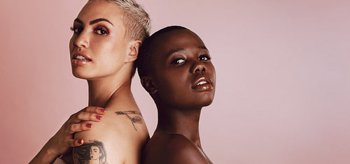 Multi-ethnic female model standing back to back