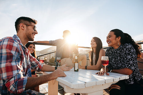 Group of young people having a rooftop party