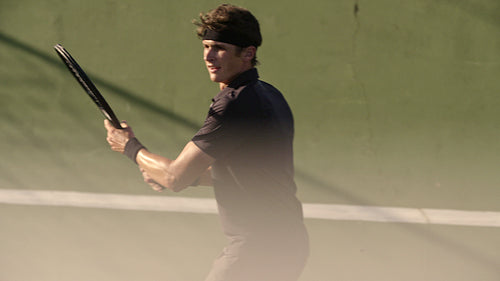 Tennis player perfecting his forehands technique