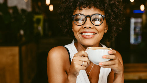 Woman at cafe having coffee