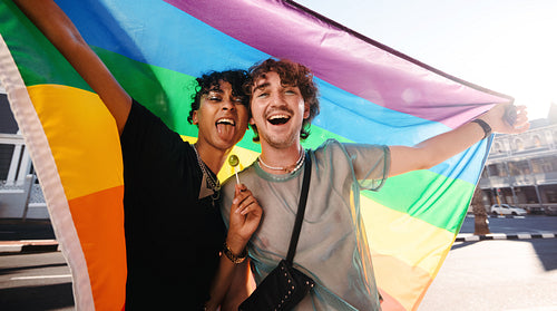 Non-conforming men celebrating gay pride outdoors